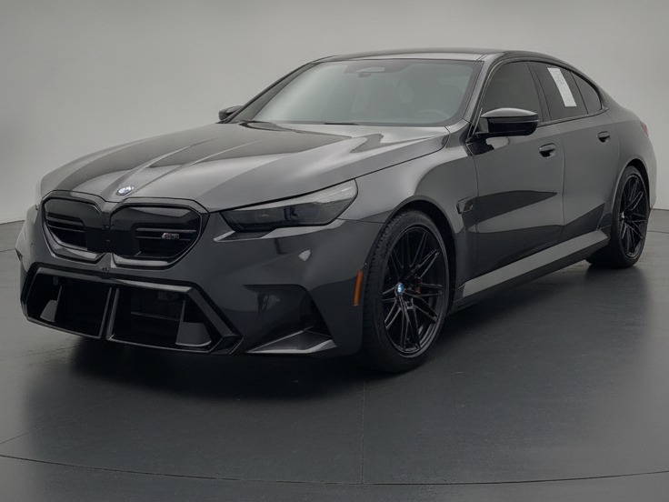 BMW M5 front angle, finished by the PrimeDrive Studio Engine — shot on a dealership lot, delivered on a showroom floor